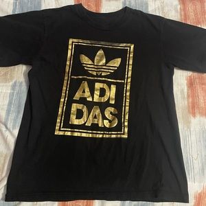 girl/boy medium black and gold adidas shirt
